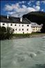 In the foreground the river Inn. At the shore of the river the old noble houses of La Punt.